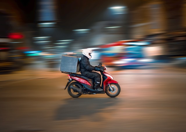 Delivery driver on a motorbike